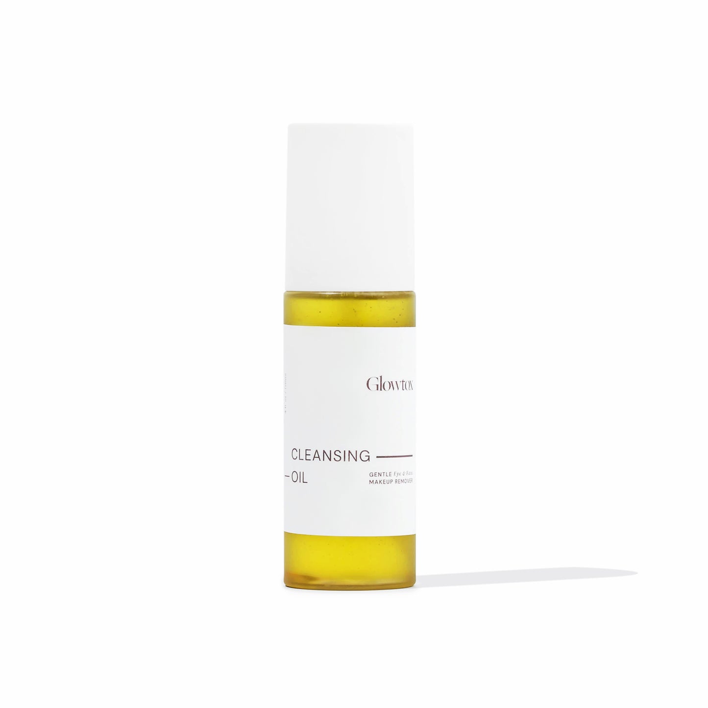 Bottle of Glowtox Cleansing Oil with a white cap, featuring minimalist packaging and a yellow oil inside.