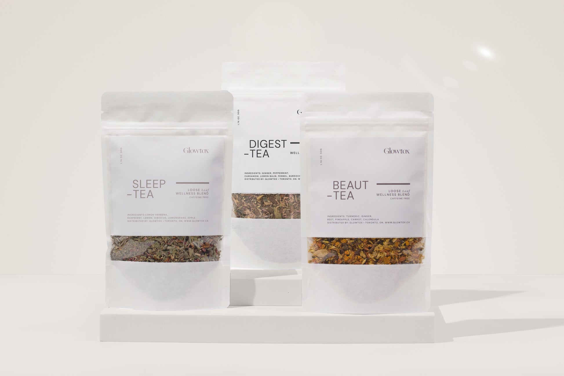 Three packaged herbal teas labeled "Sleep-Tea," "Digest-Tea," and "Beaut-Tea" displayed on a minimalistic white background.